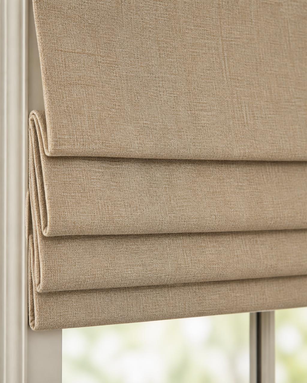 Roman blinds with soft folds in a Coimbatore bedroom
