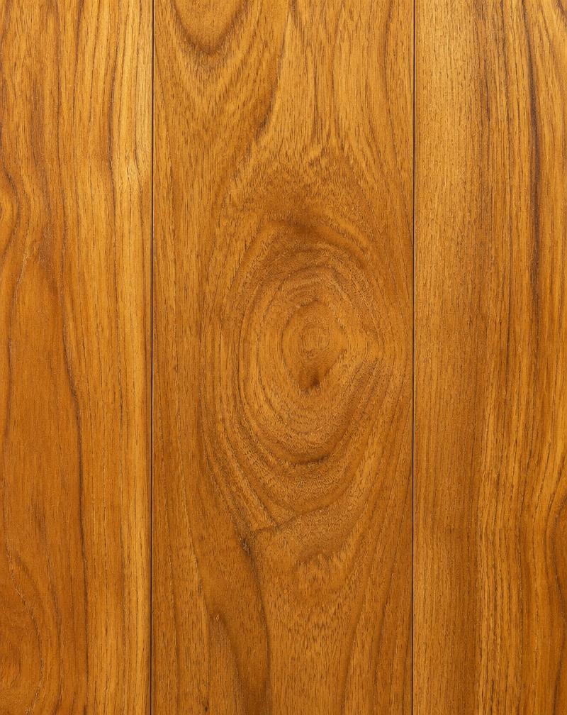 Classic teak finish wooden flooring in a Coimbatore home hall