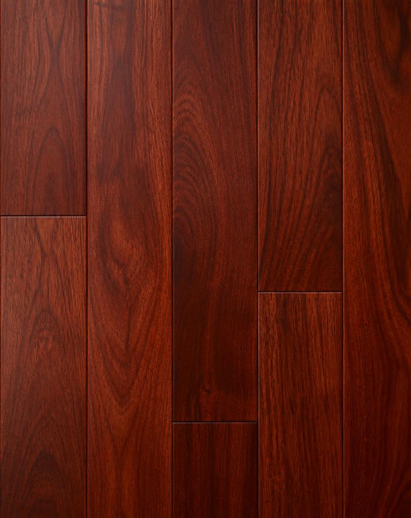 Rich mahogany wooden flooring planks with warm red undertone in a Coimbatore interior